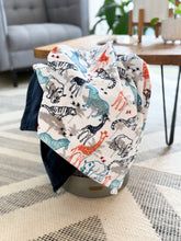 Load image into Gallery viewer, Handmade Tundra toddler blanket in a 3x5' size, ideal for strollers, toddler beds, and gifting.
